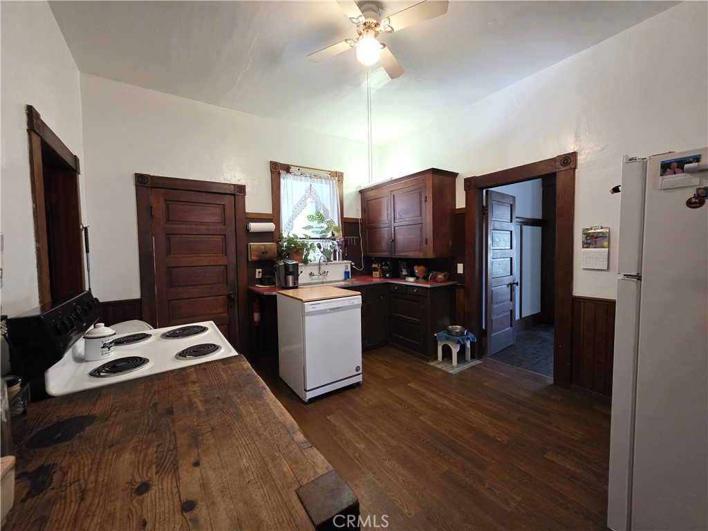 1414 Marin Street Corning, CA 96021 - Photo 7 of 43 a kitchen with a refrigerator and a sink