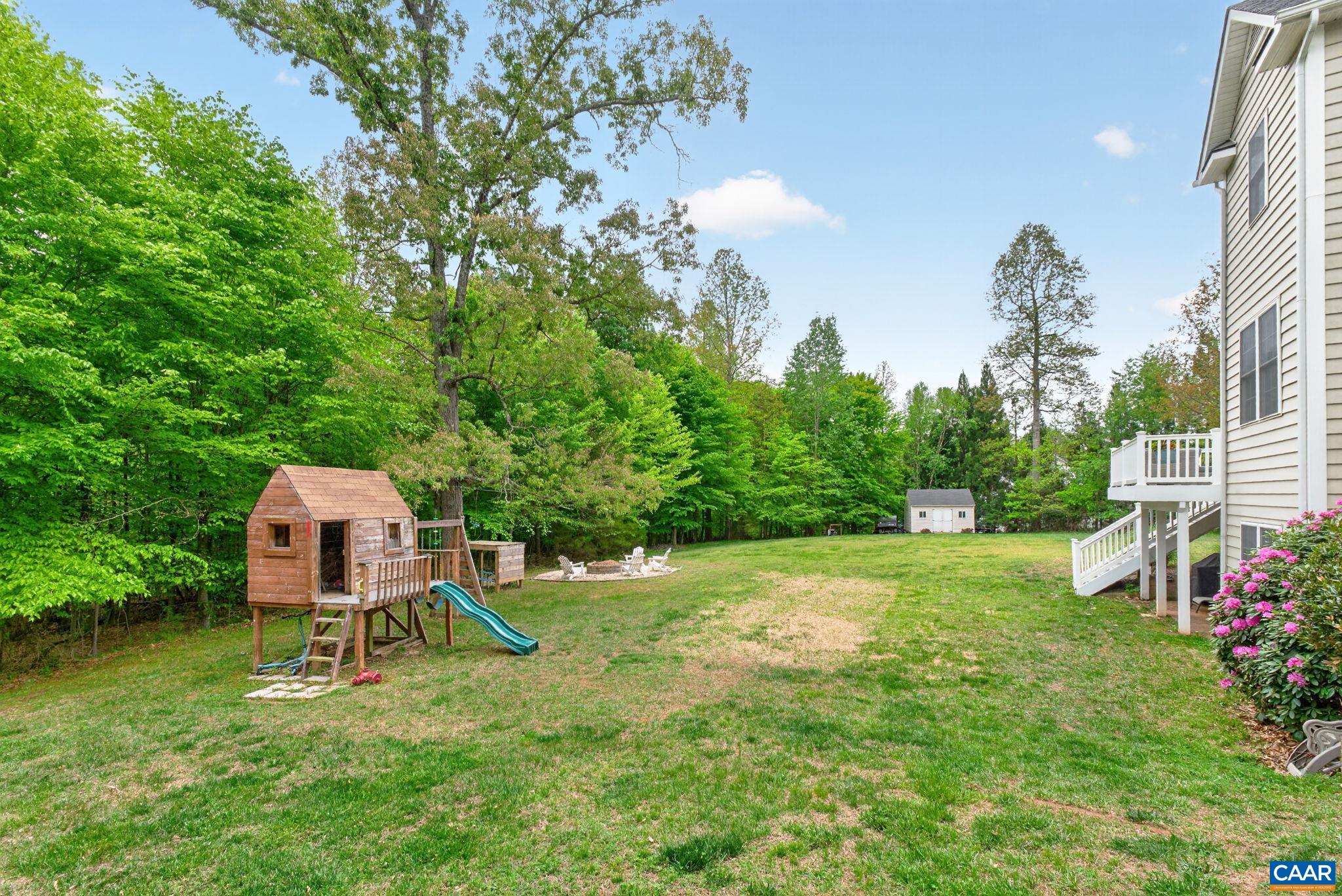 511 Taylor Ridge Way Palmyra, VA 22963 - Photo 48 of 57 a backyard of a house with table and chairs