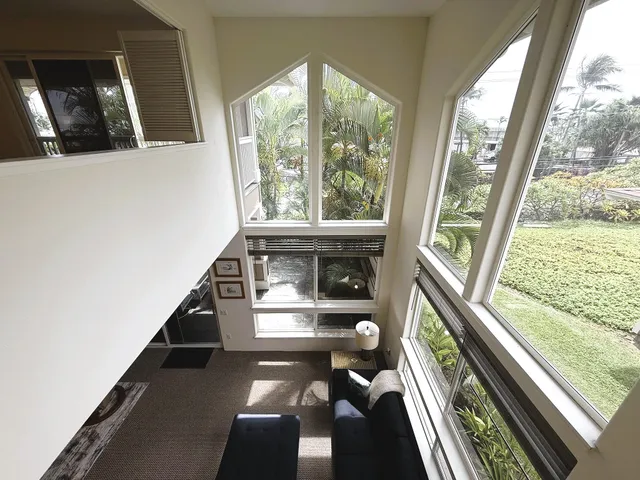 a view of a balcony with wooden floor