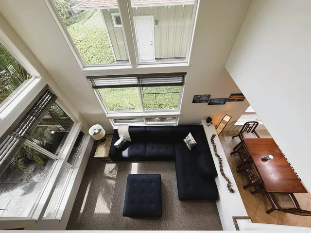 a view of living room with furniture and a large window