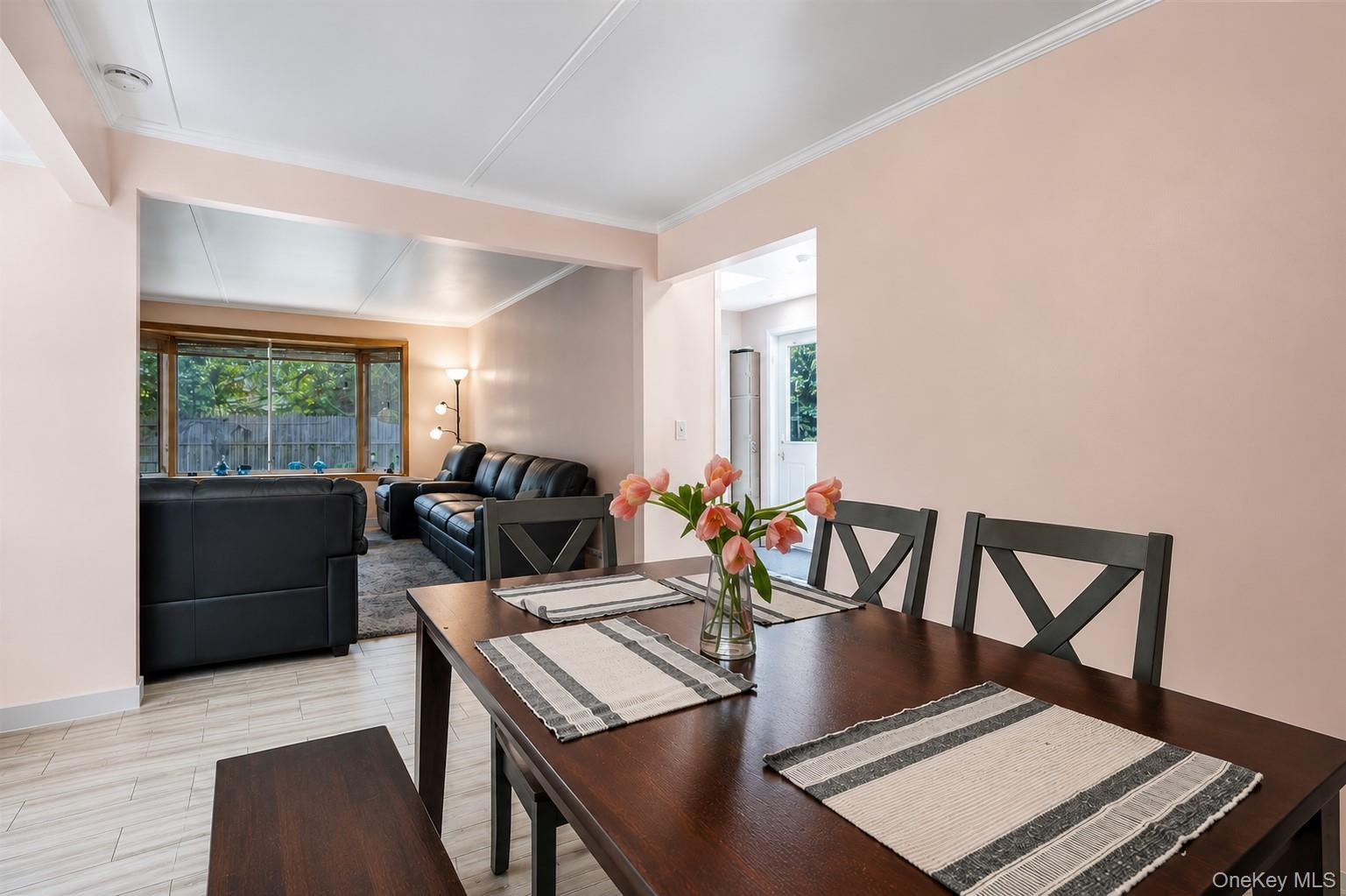 1 Windsor Road Monroe, NY 10950 - Photo 9 of 20 a view of a dining room with furniture a potted plant and wooden floor