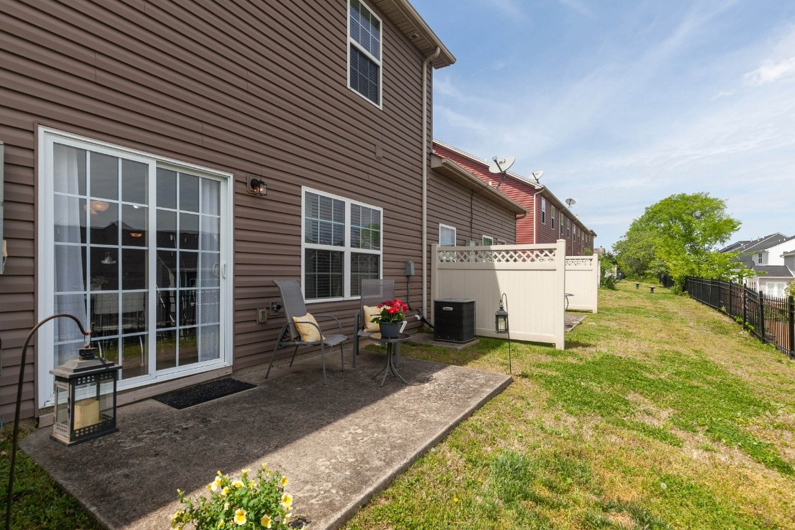 8338 Rossi Road Brentwood, TN 37027 - Photo 16 of 16 a view of a house with a yard and sitting area