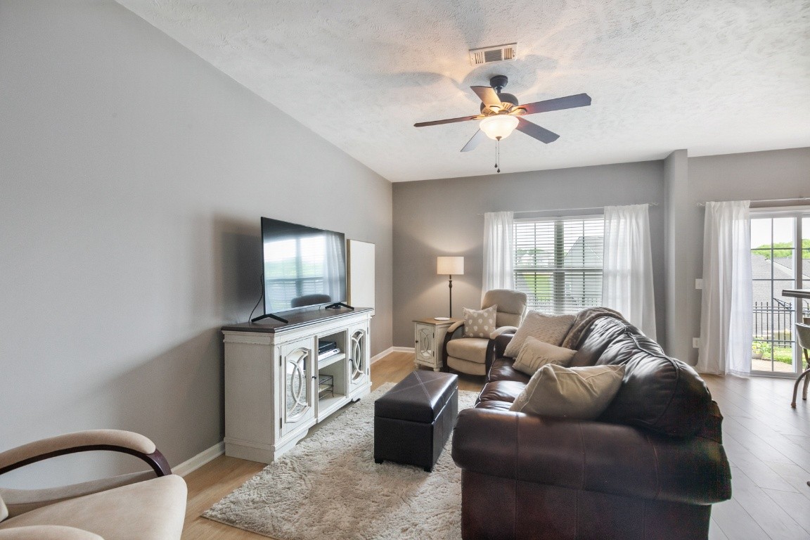 8338 Rossi Road Brentwood, TN 37027 - Photo 4 of 16 a living room with furniture and a flat screen tv