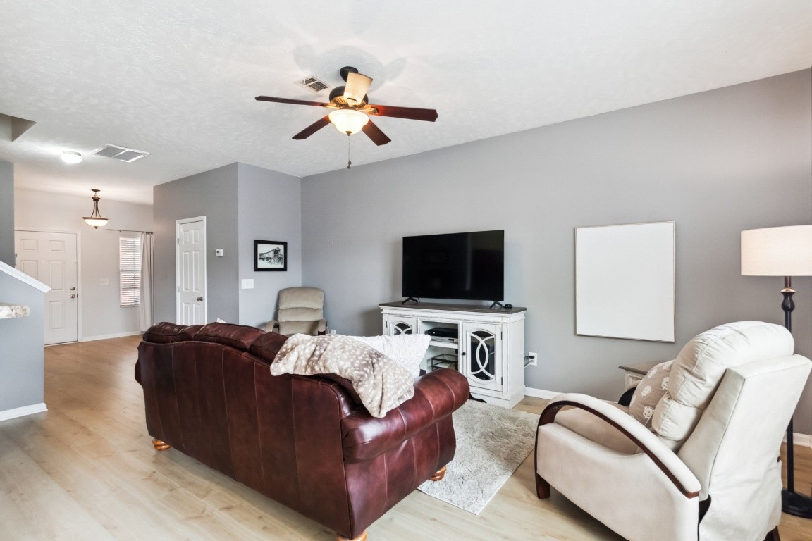 8338 Rossi Road Brentwood, TN 37027 - Photo 5 of 16 a living room with furniture and a flat screen tv