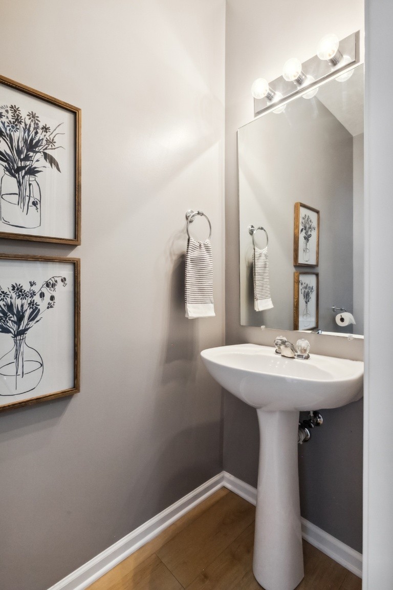 8338 Rossi Road Brentwood, TN 37027 - Photo 9 of 16 a bathroom with a sink and a mirror