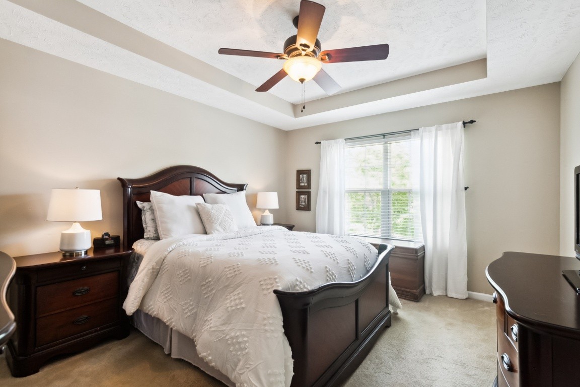 8338 Rossi Road Brentwood, TN 37027 - Photo 10 of 16 a bedroom with a bed and a chandelier