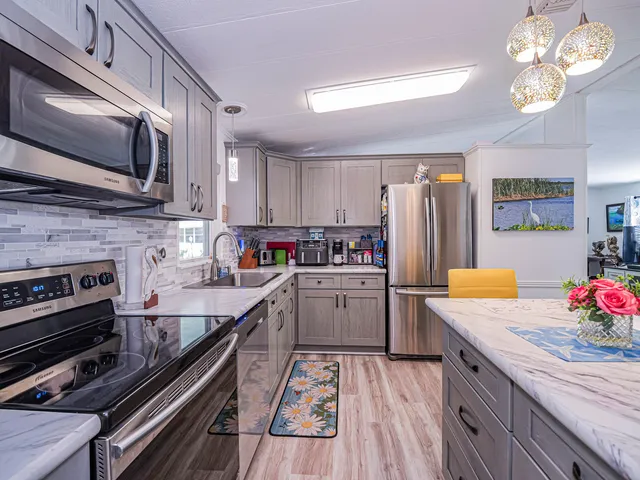 a kitchen with a dining table and chairs