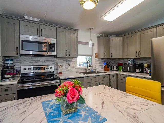 a view of a dining room with furniture and a window