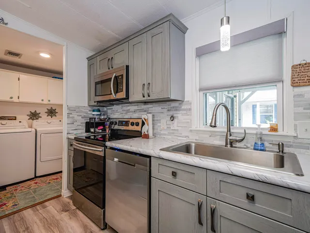 a view of a dining room with furniture and a table