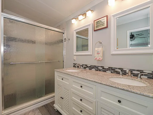 a bedroom with a bed and a table