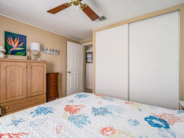 a view of washer and dryer with kitchen in the background
