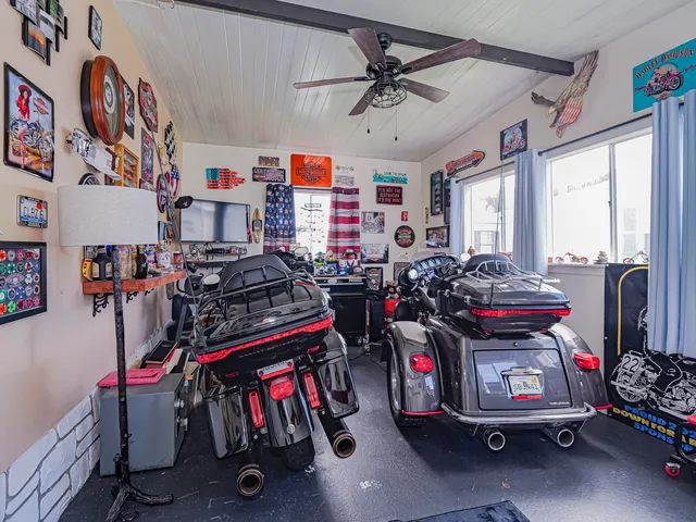 a view of a two chairs and table in the balcony