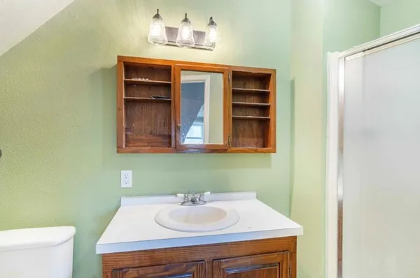 a bathroom with a sink and a toilet