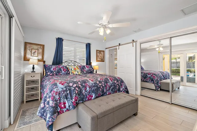 a bedroom with a bed couch and window