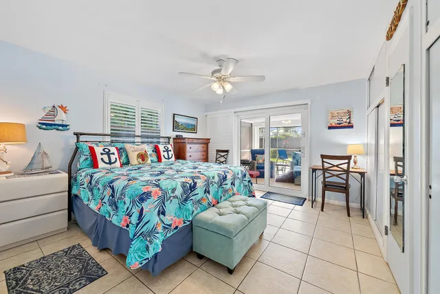 a bedroom with a bed and a table in it