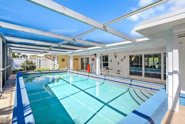 a view of a swimming pool with a patio