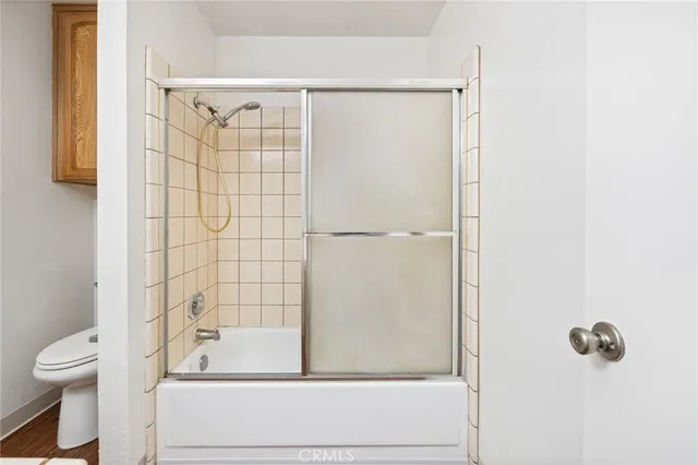 a bathroom with a shower and a toilet