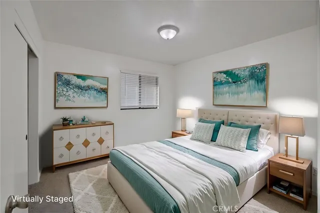 a bedroom with a bed and a baby crib