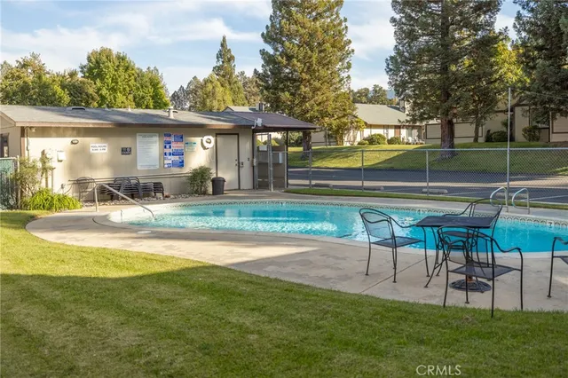 a view of a house with a yard patio and slide