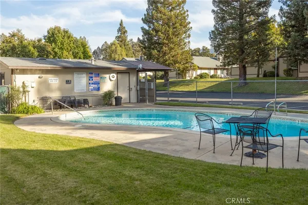 a view of a house with a yard patio and slide