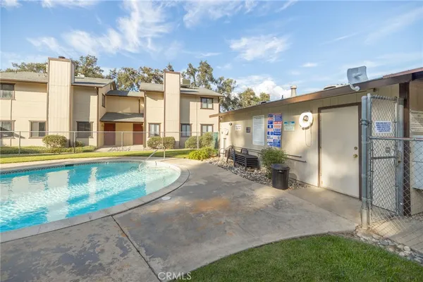 a view of swimming pool with outdoor seating