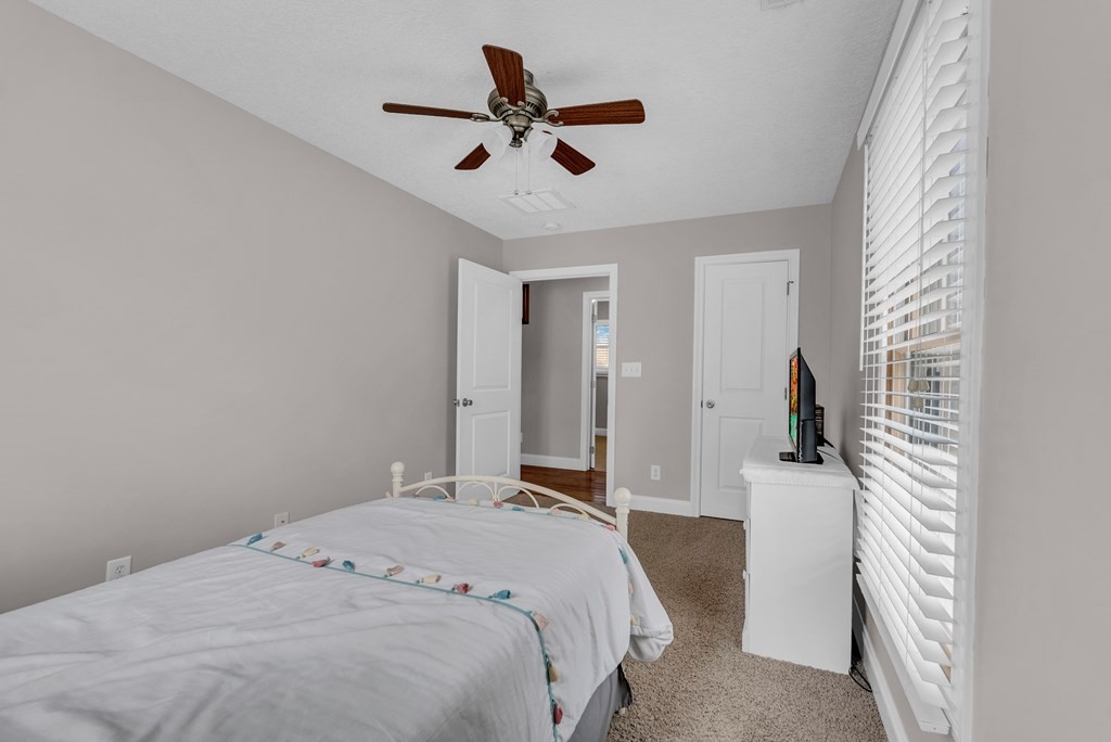 465 Hickory Lane Sparta, TN 38583 - Photo 38 of 46 a bedroom with a bed and a ceiling fan