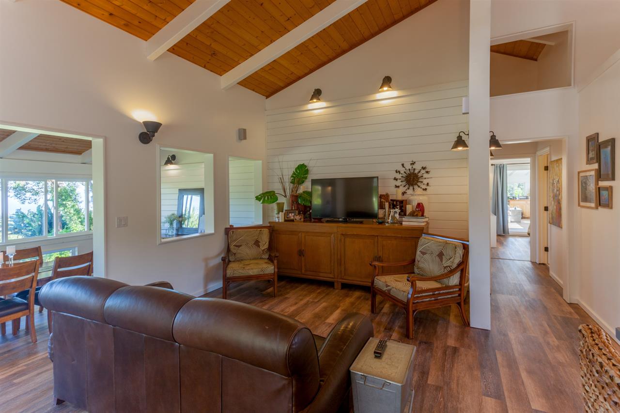 53 Awalau Road Haiku, HI 96708 - Photo 6 of 30 a living room with furniture and a wooden floor