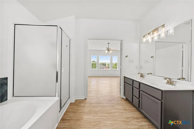 a bathroom with a sink double vanity and a mirror