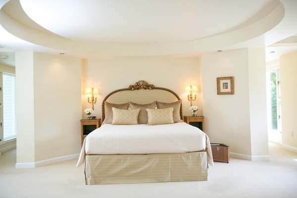 474 Glen Road Weston, MA 02493 - Photo 15 of 30 a bedroom with a bed and a painting on the wall