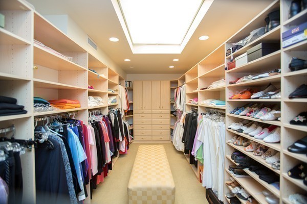 474 Glen Road Weston, MA 02493 - Photo 18 of 30 a view of walk in closet with clothes and shoes
