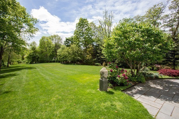 474 Glen Road Weston, MA 02493 - Photo 23 of 30 a view of a garden with a fountain