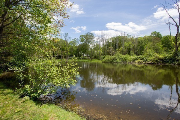 474 Glen Road Weston, MA 02493 - Photo 27 of 30 a view of a lake with houses in the back