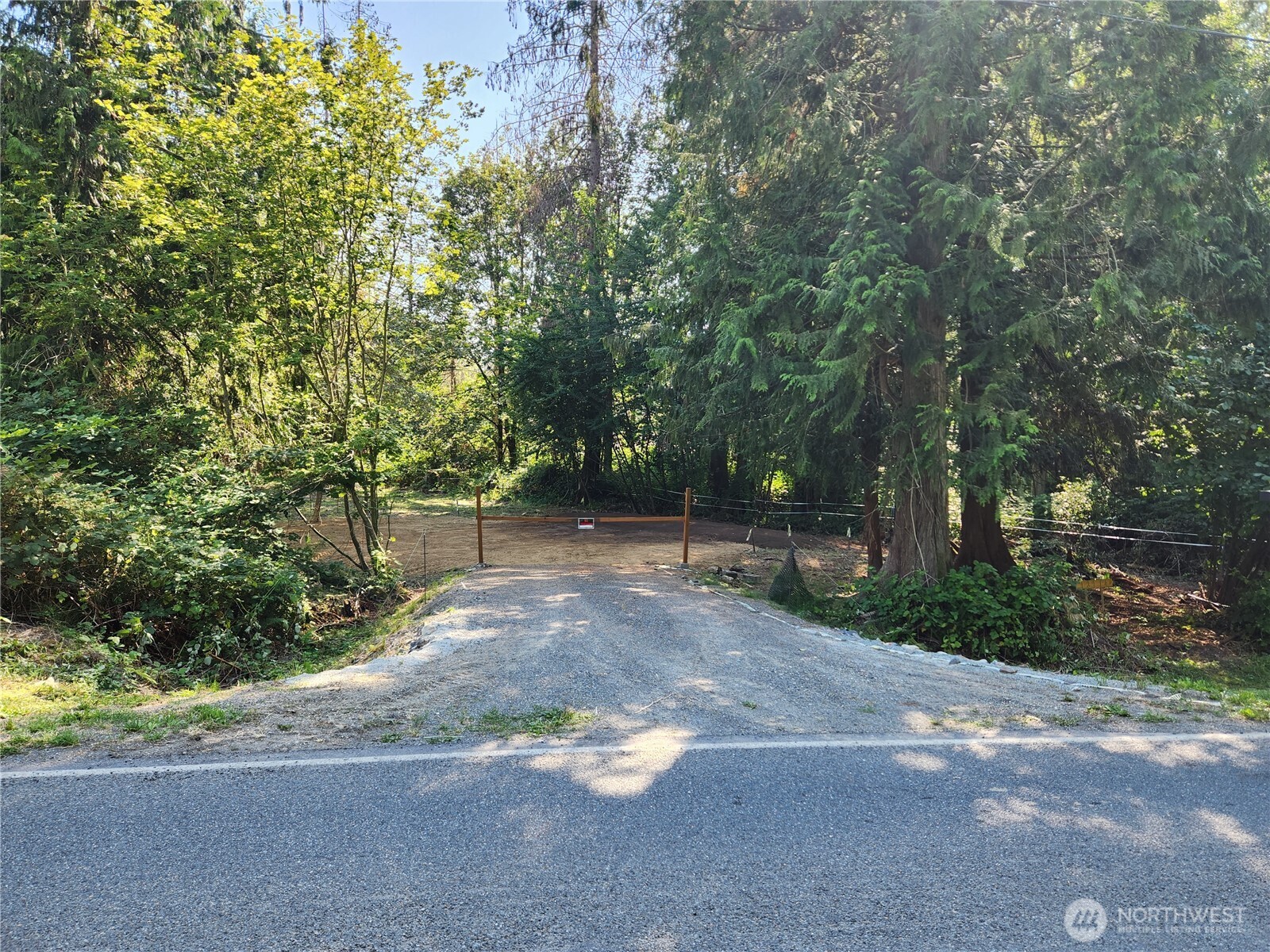 12114 Jordan Road Arlington, WA 98223 - Photo 1 of 19 a view of a street with a tree
