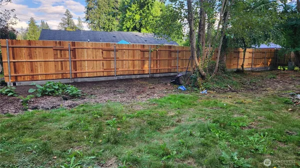 a backyard of a house with lots of green space