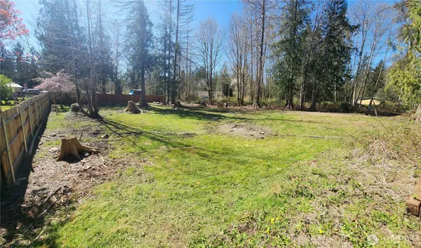 a view of swimming pool with a yard