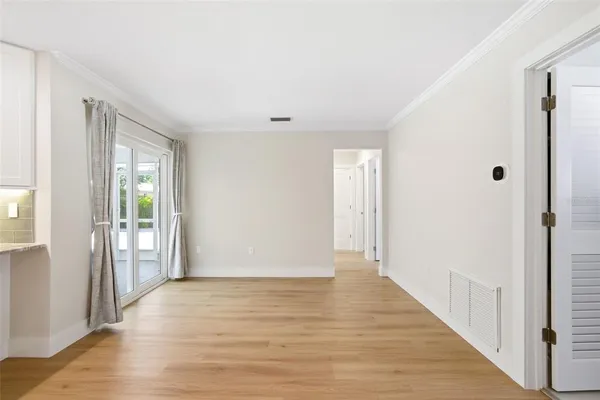 a view of room with window and ceiling fan