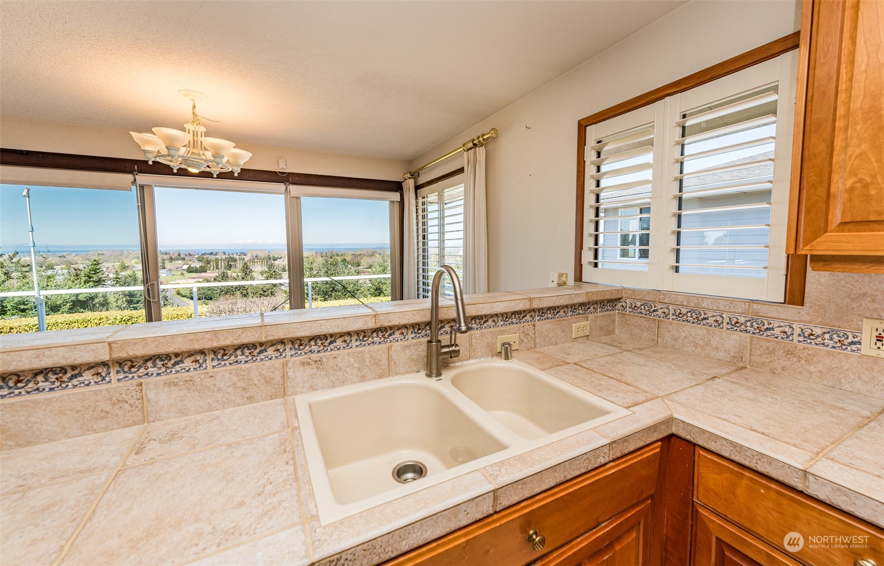 653 Brigadoon Boulevard Sequim, WA 98382 - Photo 11 of 40 a bathroom with a sink and a large window