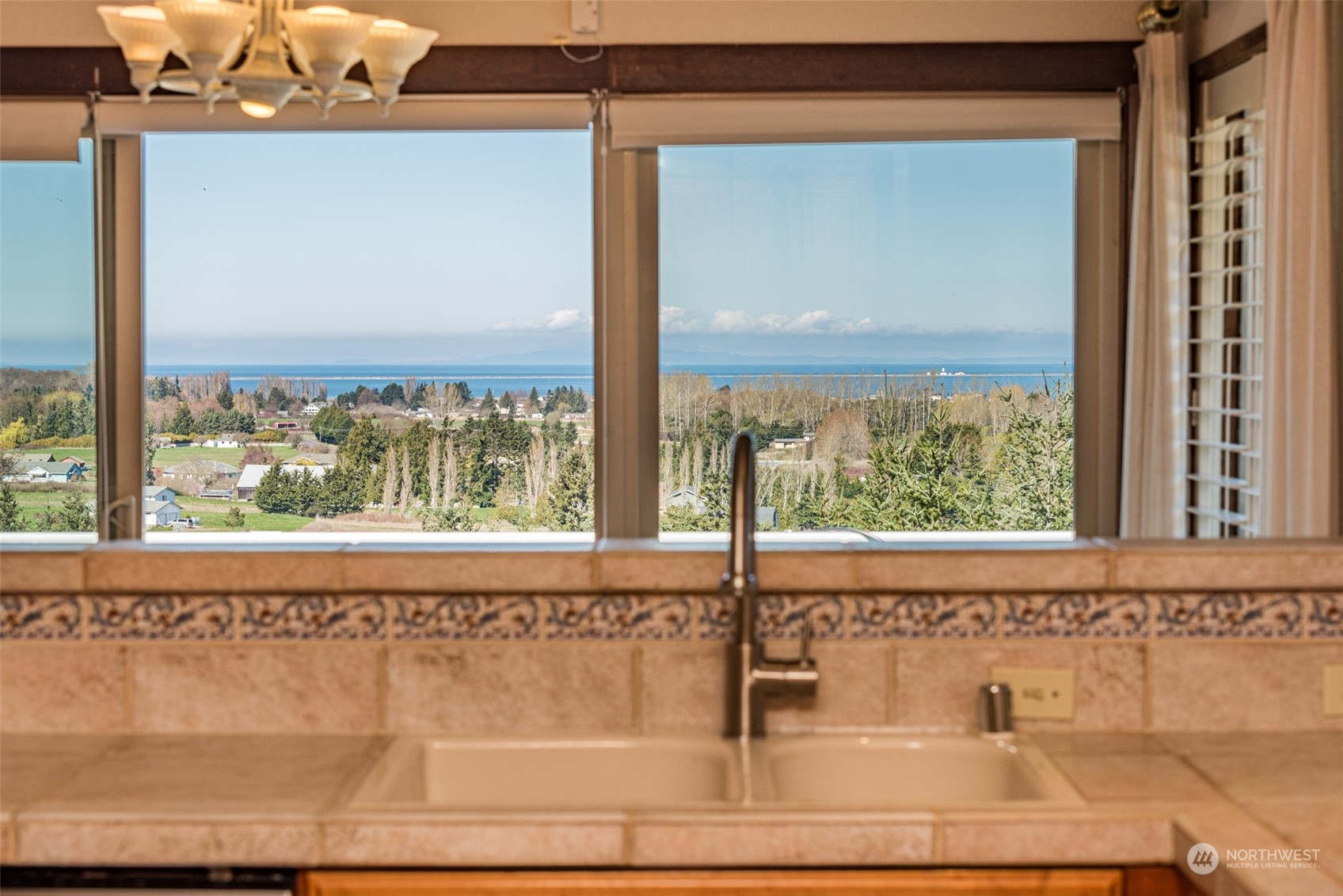 653 Brigadoon Boulevard Sequim, WA 98382 - Photo 12 of 40 a view of a sink with a window