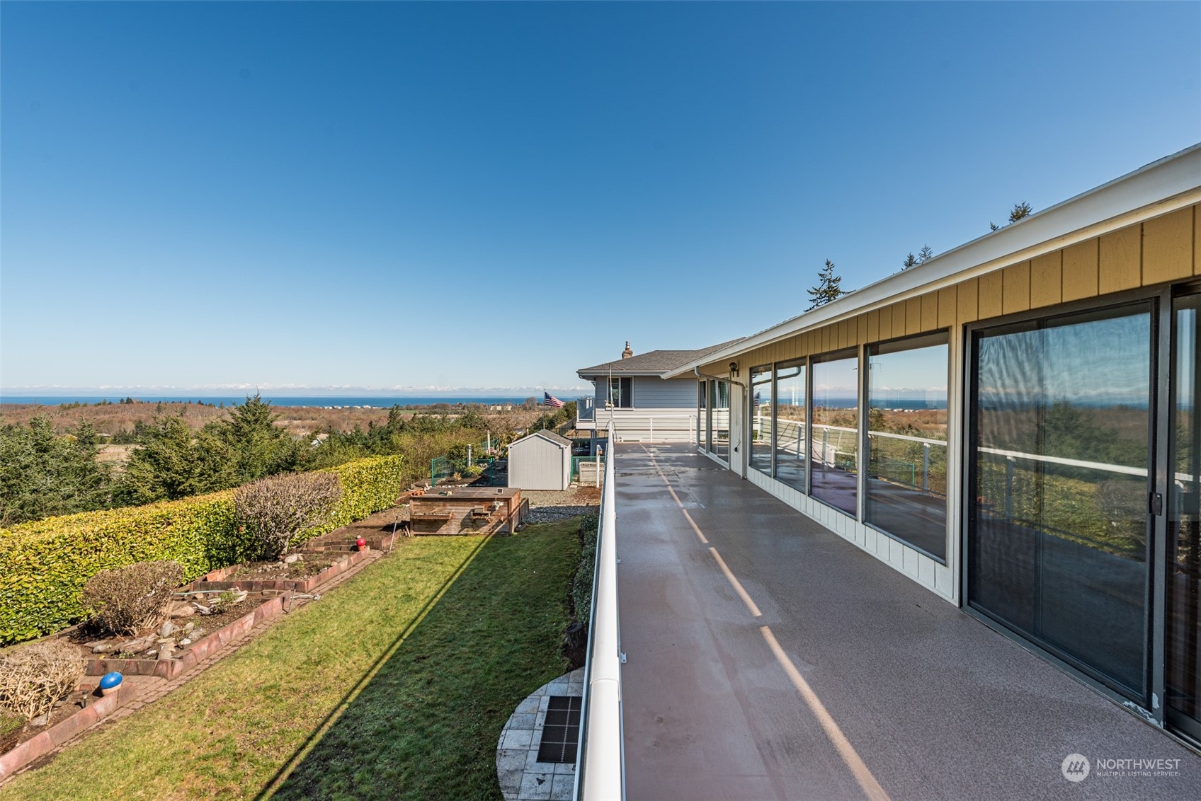 653 Brigadoon Boulevard Sequim, WA 98382 - Photo 13 of 40 a view of swimming pool with a garden