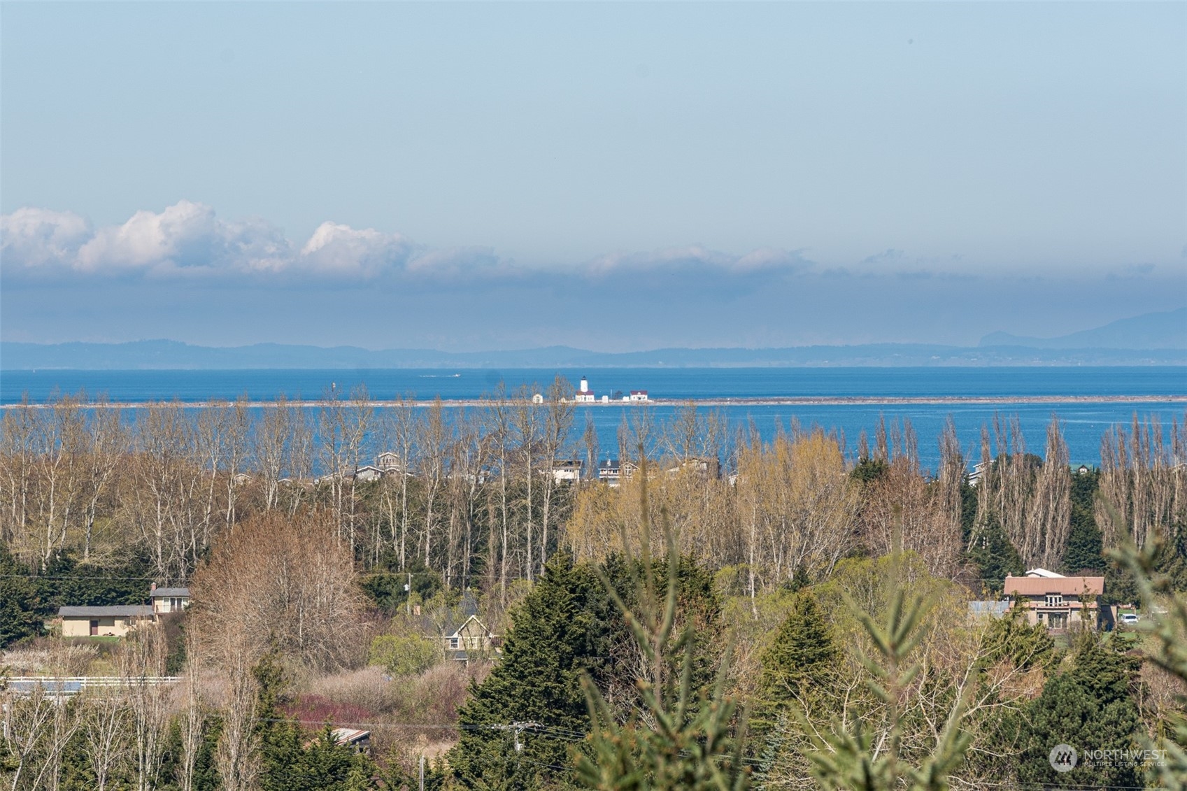 653 Brigadoon Boulevard Sequim, WA 98382 - Photo 15 of 40 a view of a lake with a city