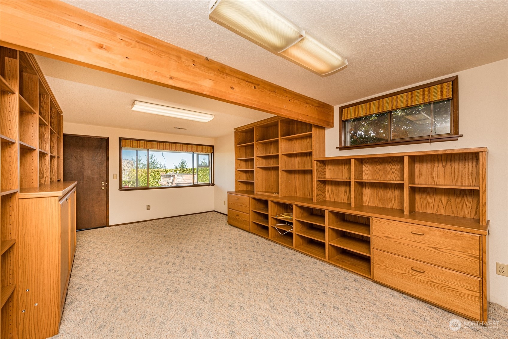 653 Brigadoon Boulevard Sequim, WA 98382 - Photo 28 of 40 a view of an empty room with cabinet and a window
