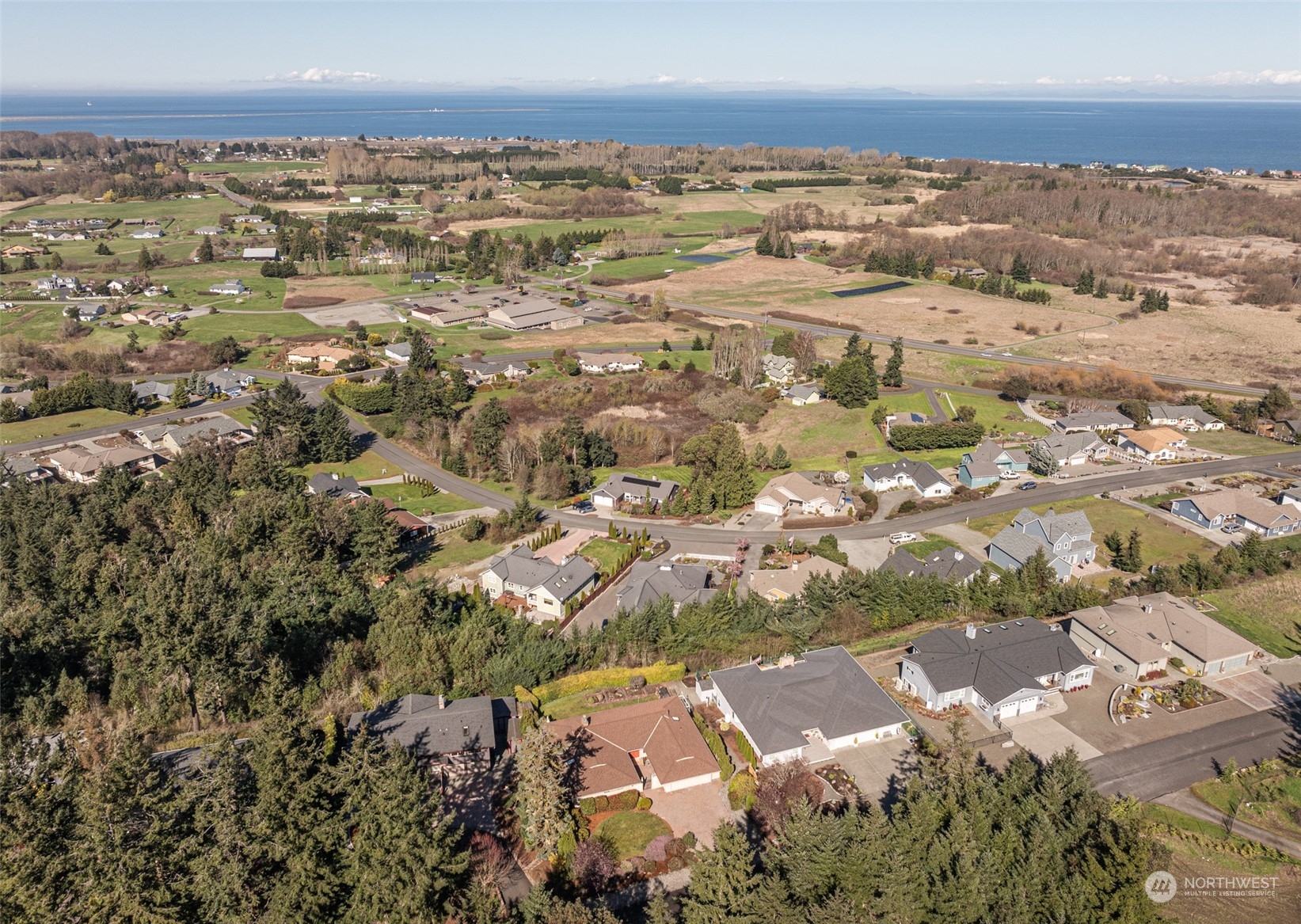 653 Brigadoon Boulevard Sequim, WA 98382 - Photo 35 of 40 an aerial view of residential houses with outdoor space