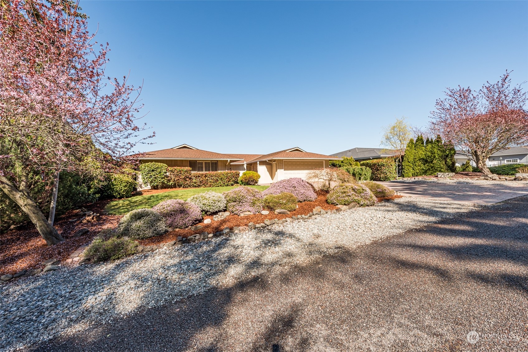 653 Brigadoon Boulevard Sequim, WA 98382 - Photo 36 of 40 a view of a road with a building in the background