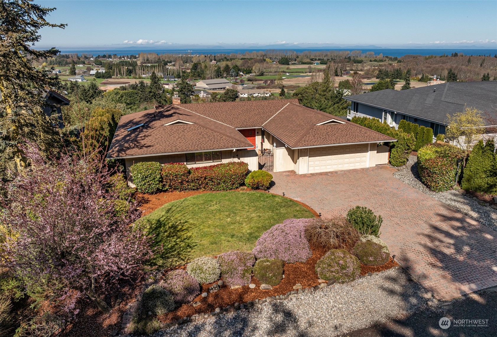 653 Brigadoon Boulevard Sequim, WA 98382 - Photo 37 of 40 a aerial view of a house with a yard