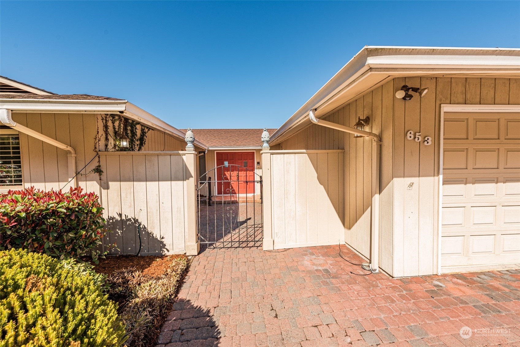 653 Brigadoon Boulevard Sequim, WA 98382 - Photo 38 of 40 a front view of a house with a yard