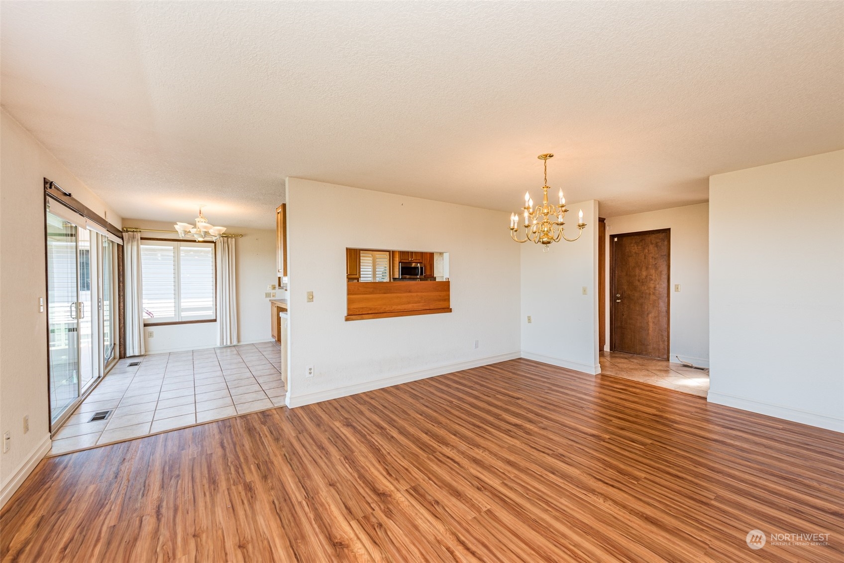 653 Brigadoon Boulevard Sequim, WA 98382 - Photo 7 of 40 a view of empty room with wooden floor