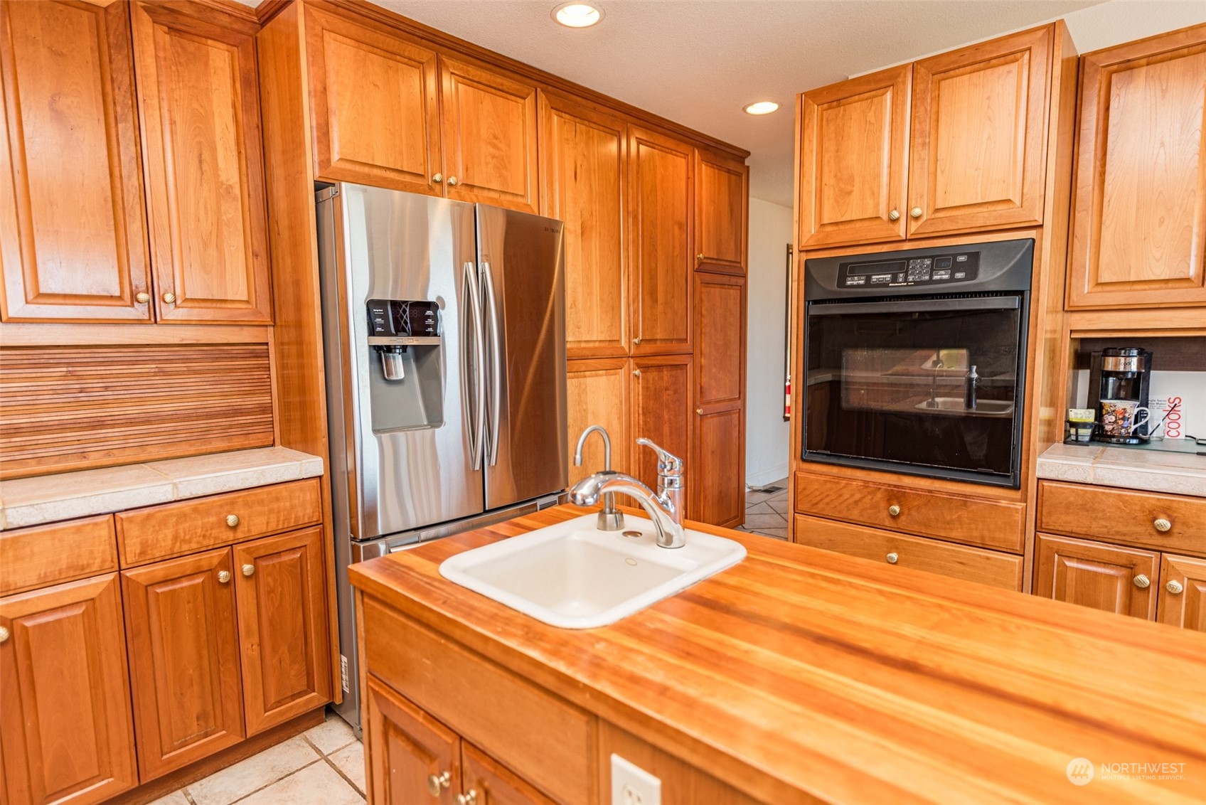 653 Brigadoon Boulevard Sequim, WA 98382 - Photo 9 of 40 a bathroom with a sink a mirror and a shower
