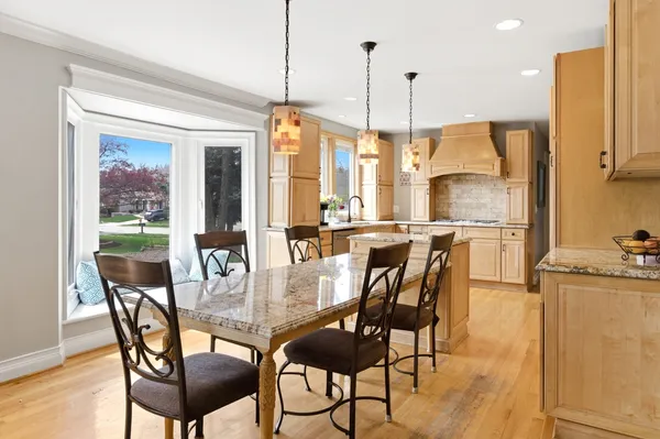 a kitchen with sink stove and cabinets