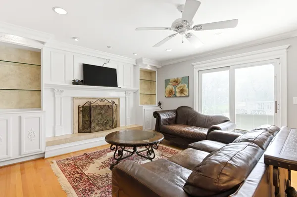 a view of a livingroom with a window and a chandelier