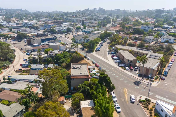 an aerial view of residential houses with outdoor space